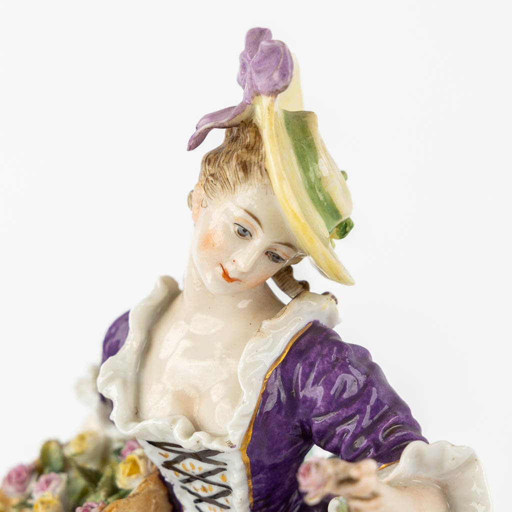 A pair of polychrome porcelain figurines, added A Saxony porcelain boy. (H:23,5 cm)