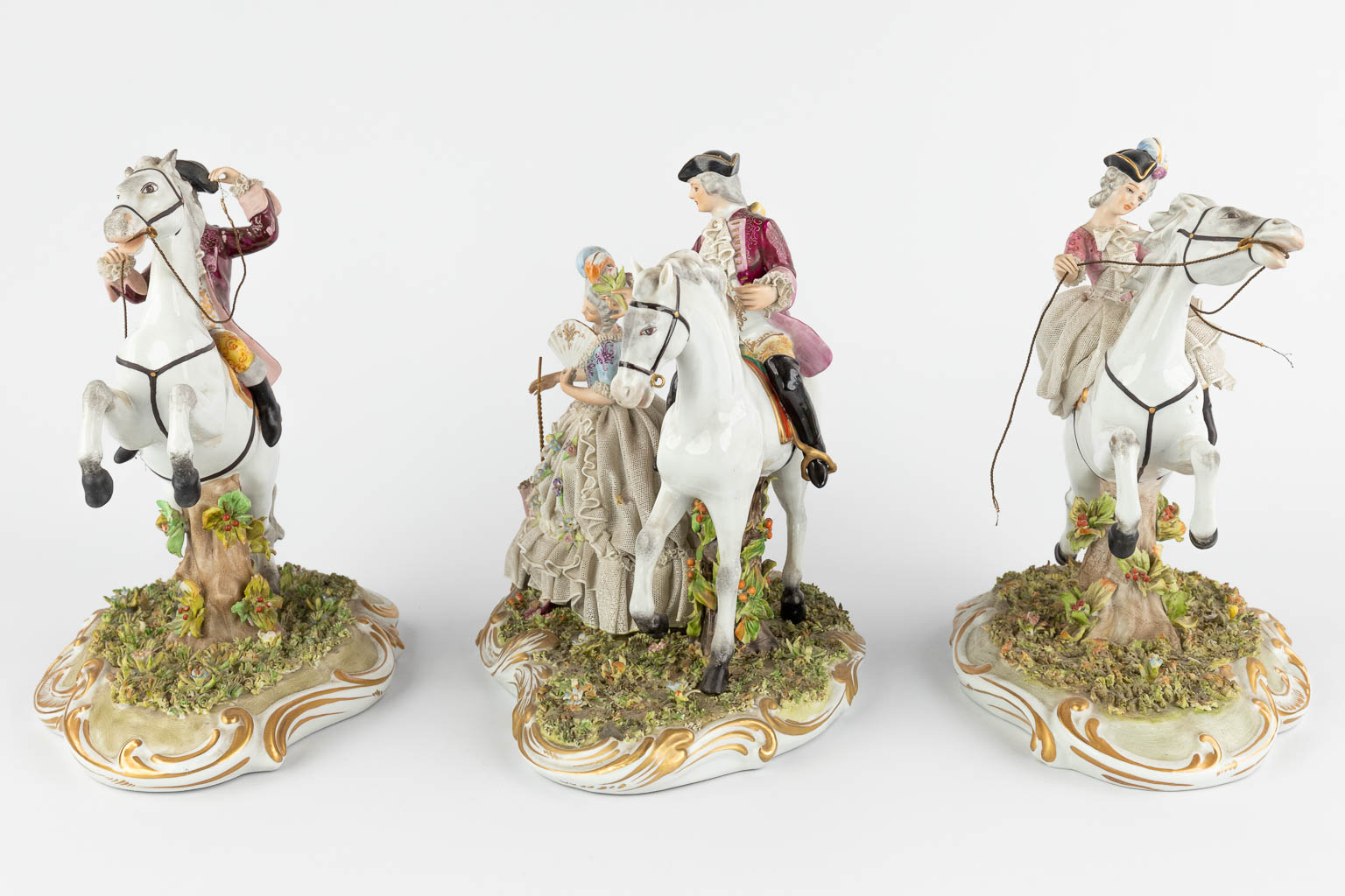 Capodimonte, three groups with horses, 20th C. (W:22 x H:26 cm)