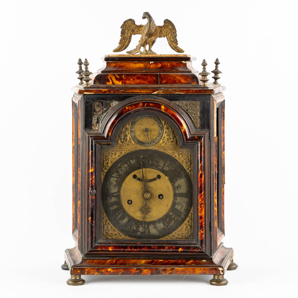 An antique Sicilian mantle clock, mounted with tortoiseshell and gilt bronze. Italy, 18th C. (L:20 x W:36 x H:53 cm)