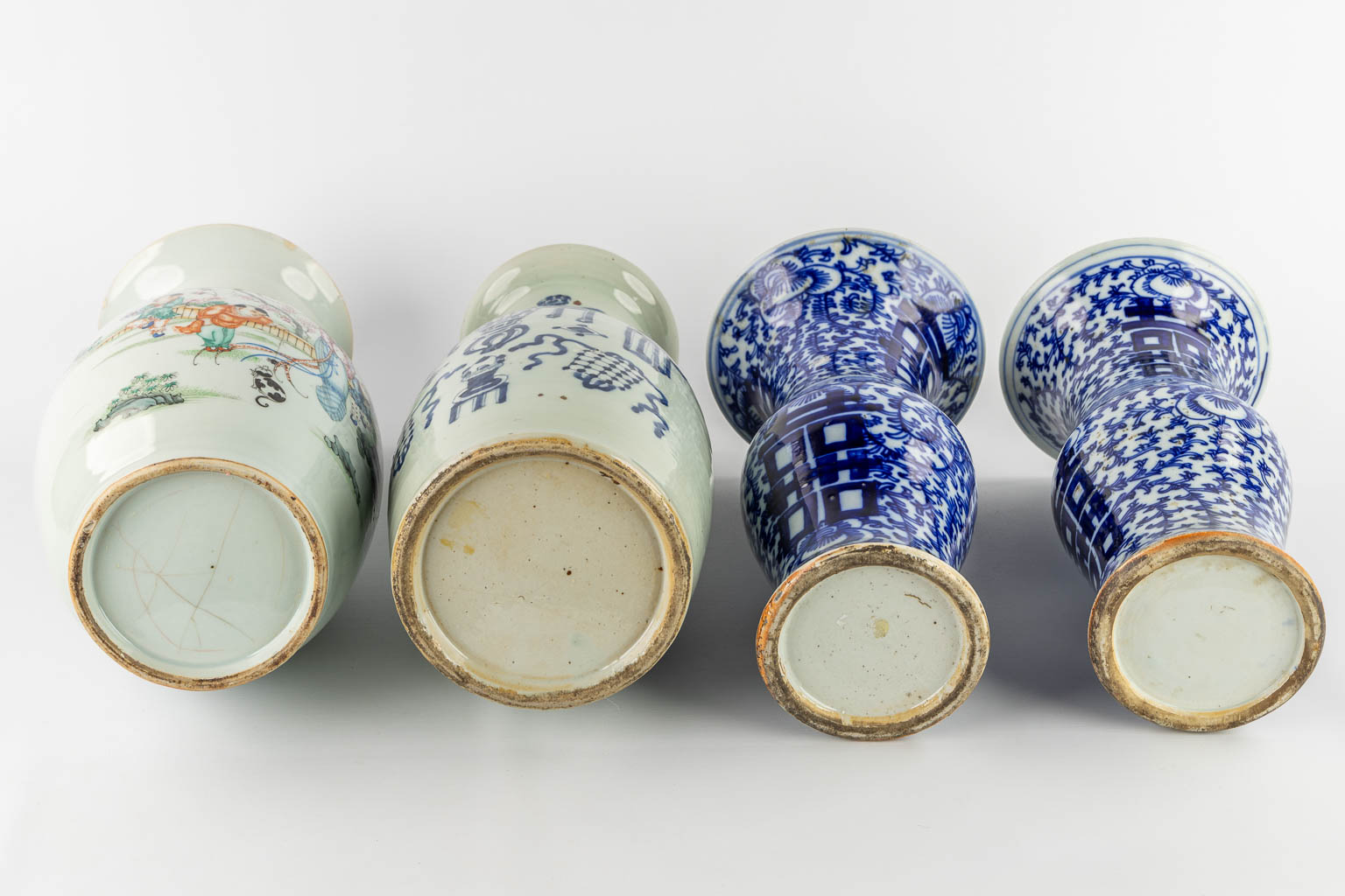 Four Chinese vases, blue white and polychrome. 