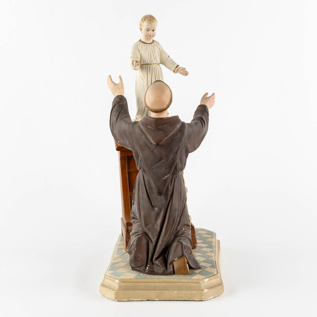 Saint Anthony with a child, polychrome plaster. Circa 1900. (L:20 x W:32 x H:44 cm)