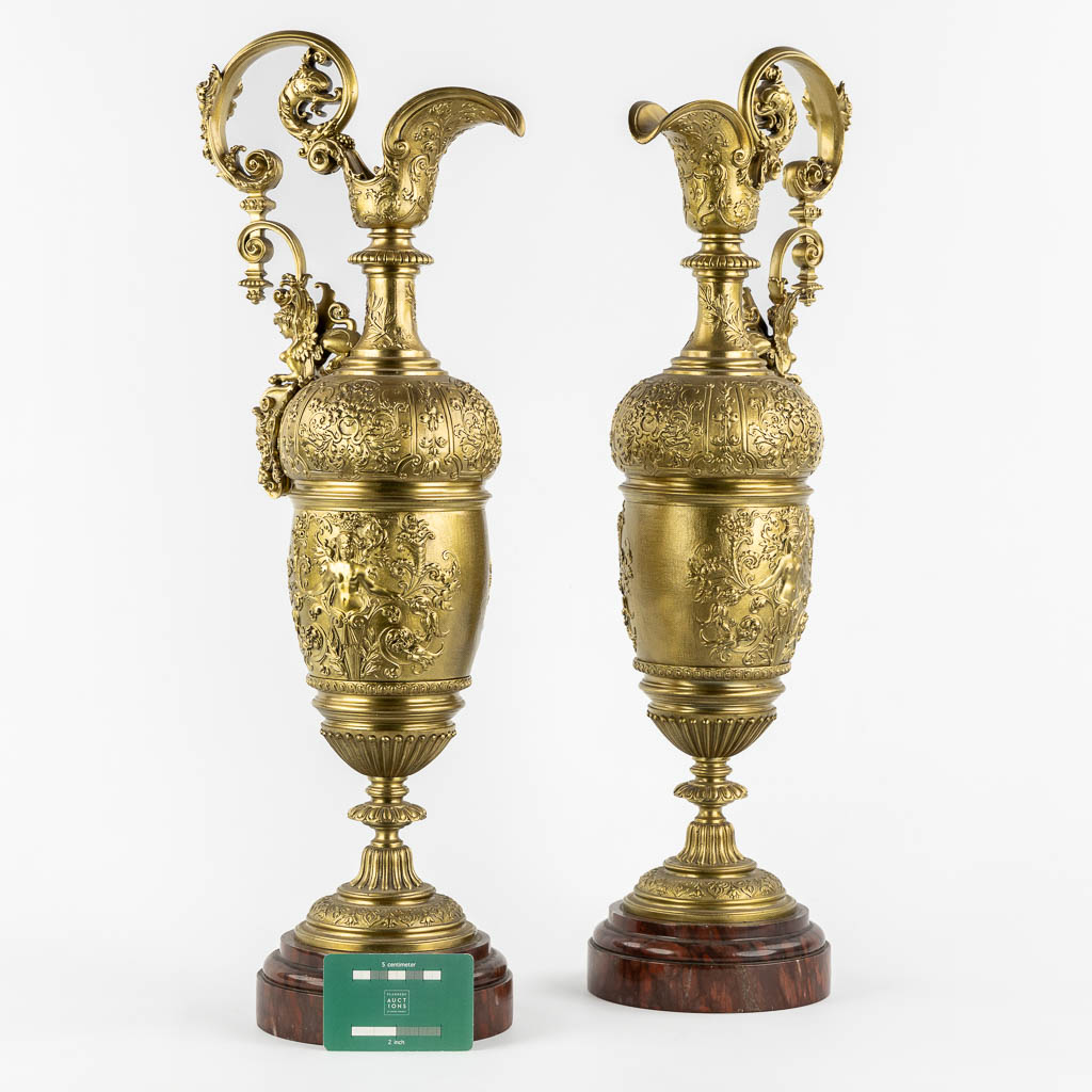 A large pair of pitchers, in the style of Ferdinand Barbedienne. 19th C. (L:15 x W:21 x H:59 cm)