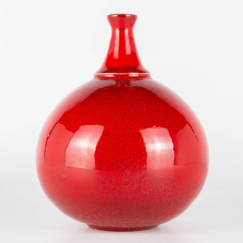 A vase made of red glazed white ceramics and probably made in Scandinavia. Period 1960-1970. 