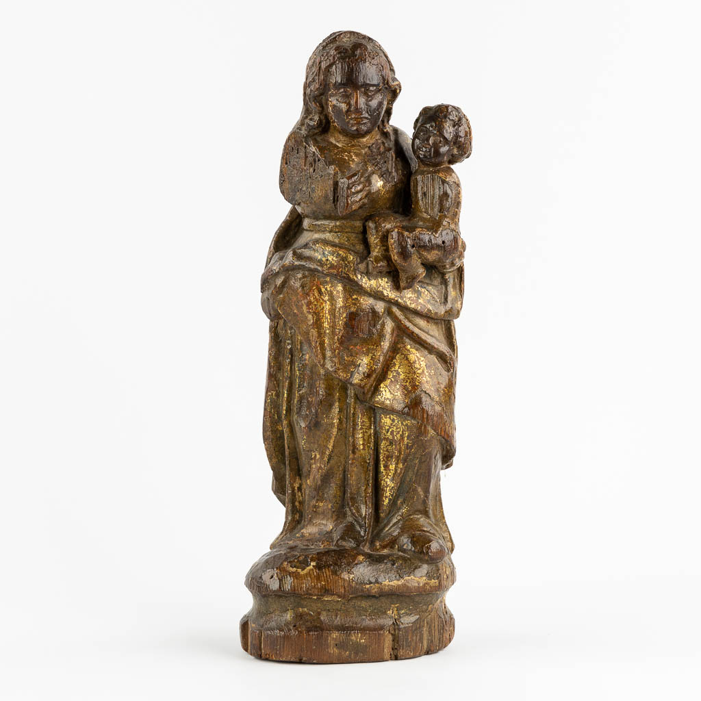 An antique wood-sculptured figurine of Madonna with a Child. 17th/18th C. (L:12 x W:16 x H:46 cm)