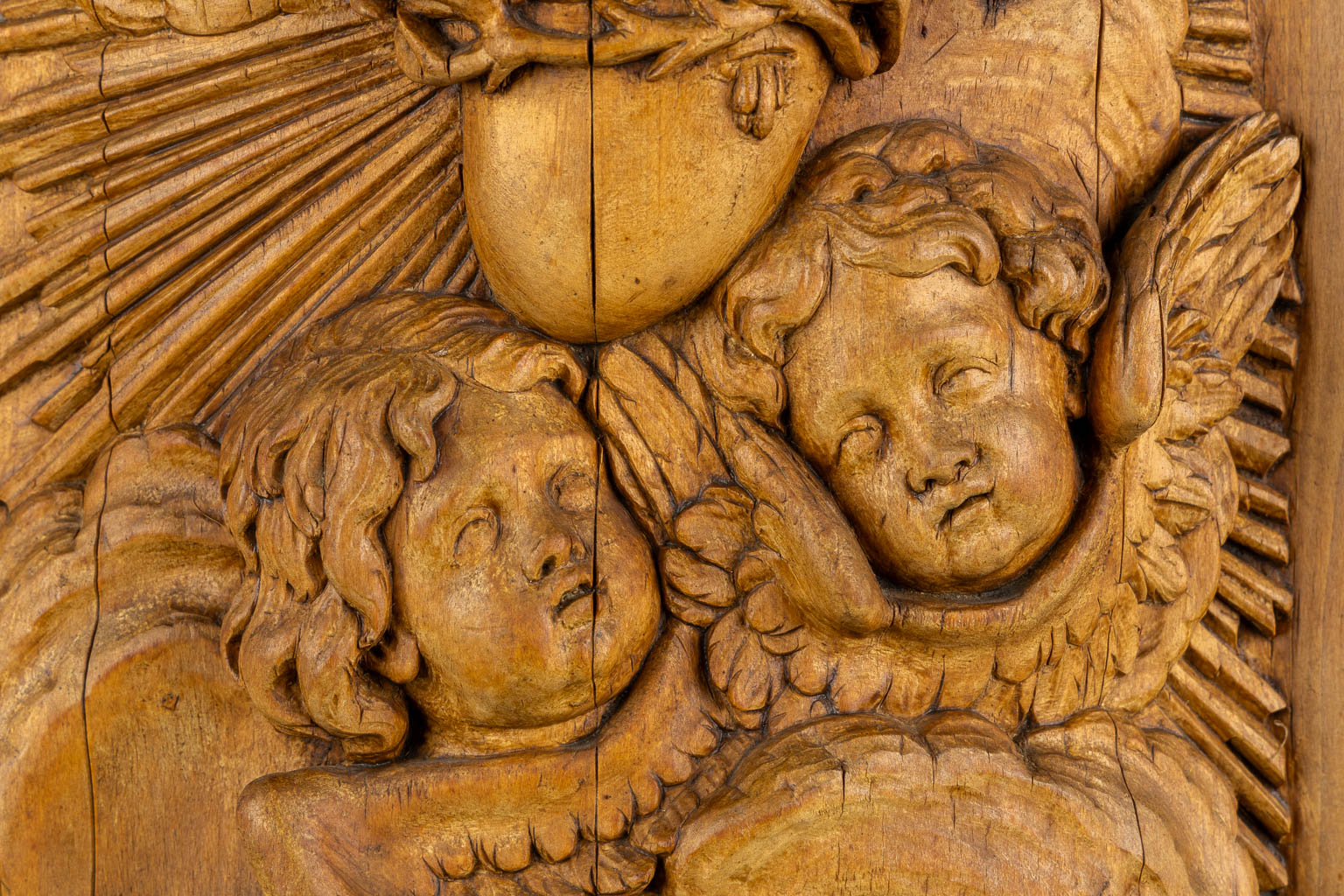 A wood-sculptured tabernacle door, Angels and a Sacred Heart, Baroque style. 