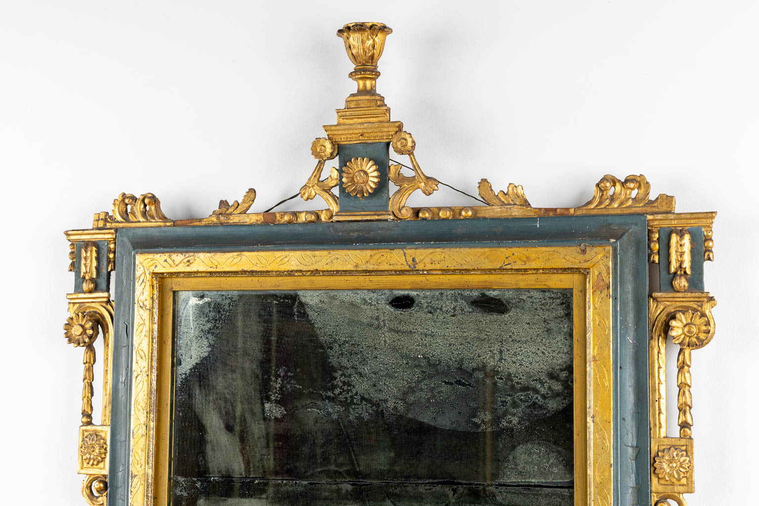 An antique mirror, gilt and patinated wood, late 18th, early 19th C. (W:84 x H:114 cm)