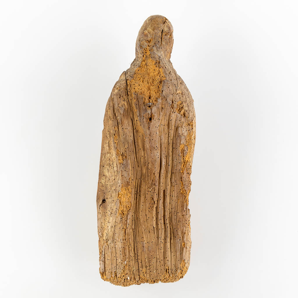 An antique wood-sculptured figurine of a saint holding a book, oak, 17th C. (L:17 x W:20 x H:53 cm)