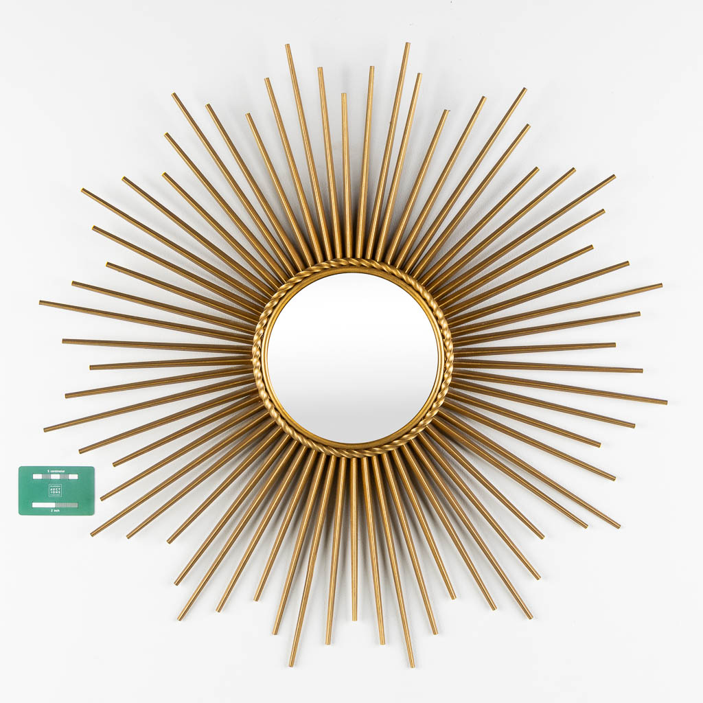 Chaty Vallauris, a sunburst mirror. Gilt metal. (D:70 cm)