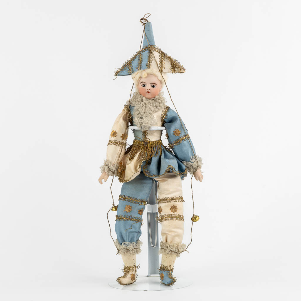 A French porcelain and fabric doll, Policinelle', circa 1900. (H:36 cm)