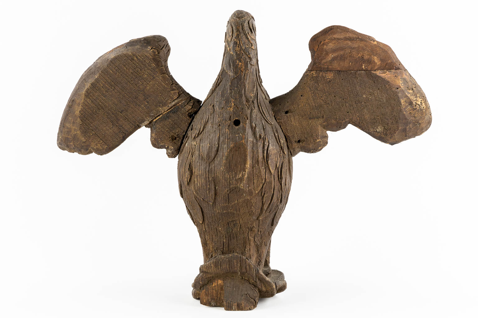 An antique wood-sculptured 'Pelican With Chicks'. 18th/19th C.