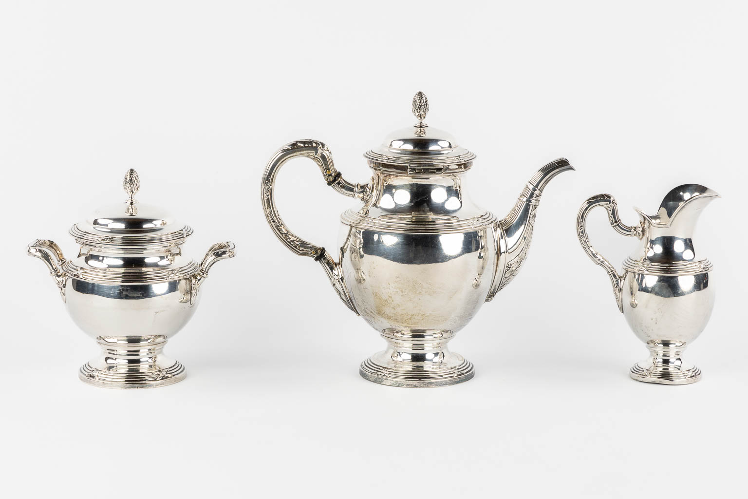 A three-piece silver coffee service, Louis XVI style, Germany, 800/1000. 1,115kg. 