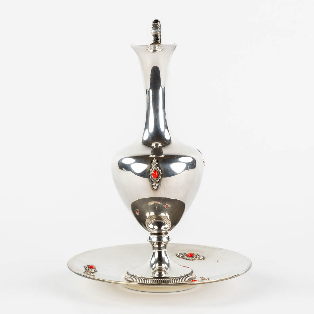 A pitcher on a saucer, silver mounted with cabochons. 800/1000. (H:22 x D:16 cm)