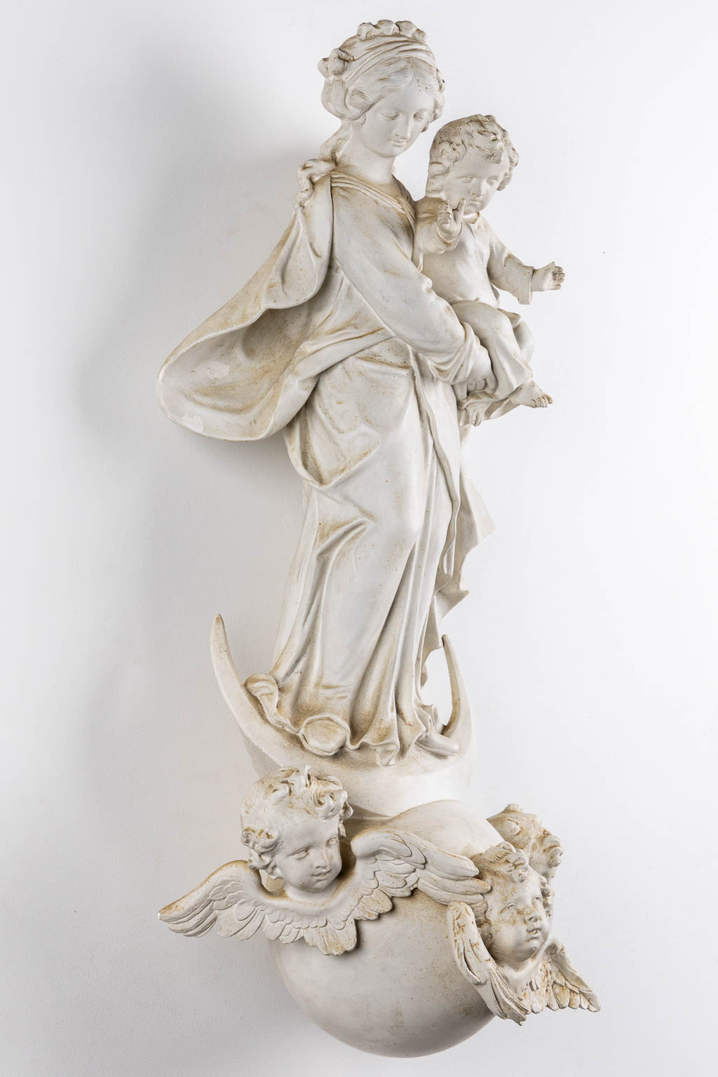 Madonna with a child, standing on a crescent moon, Baroque style. Circa 1900. (L:30 x W:42 x H:91 cm)