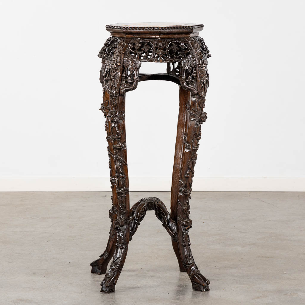 A high Oriental pedestal, sculptured hardwood with marble. (L:50 x W:50 x H:90 cm)