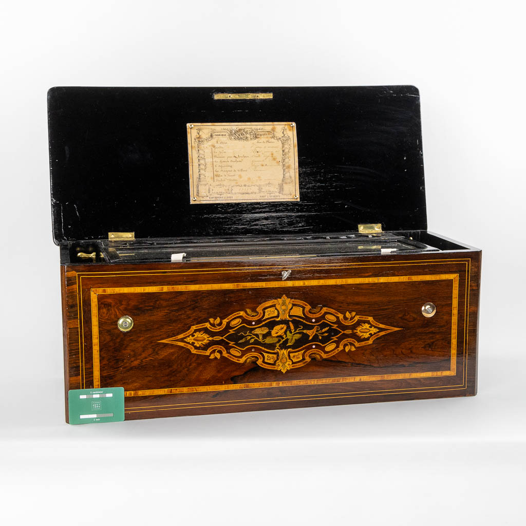 A large music box with an internal organ, in a marquetry inlay box. (L:30 x W:71 x H:27 cm)