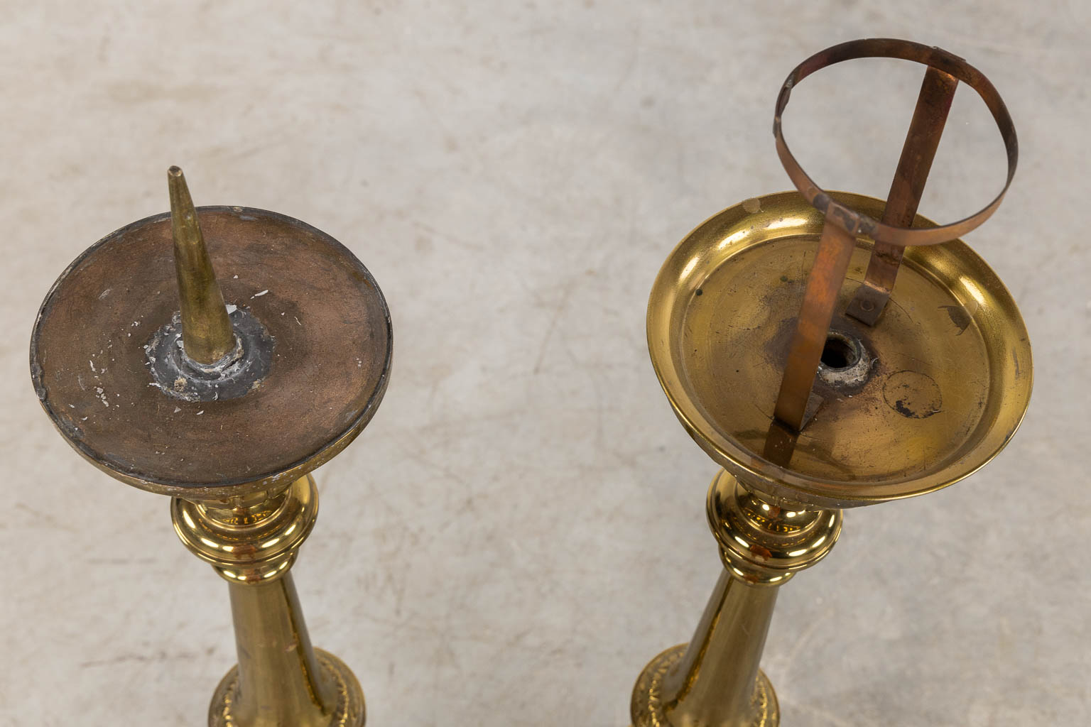 A pair of silver-plated church chandelsticks, added a pair of brass candelabra. (H:92 cm)