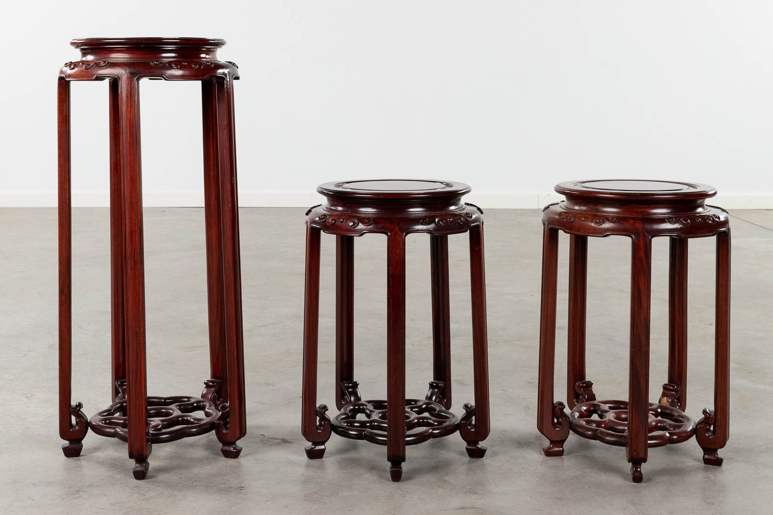 Three Oriental pedestals, sculptured hardwood. 20th C. (H:71 x D:30 cm)