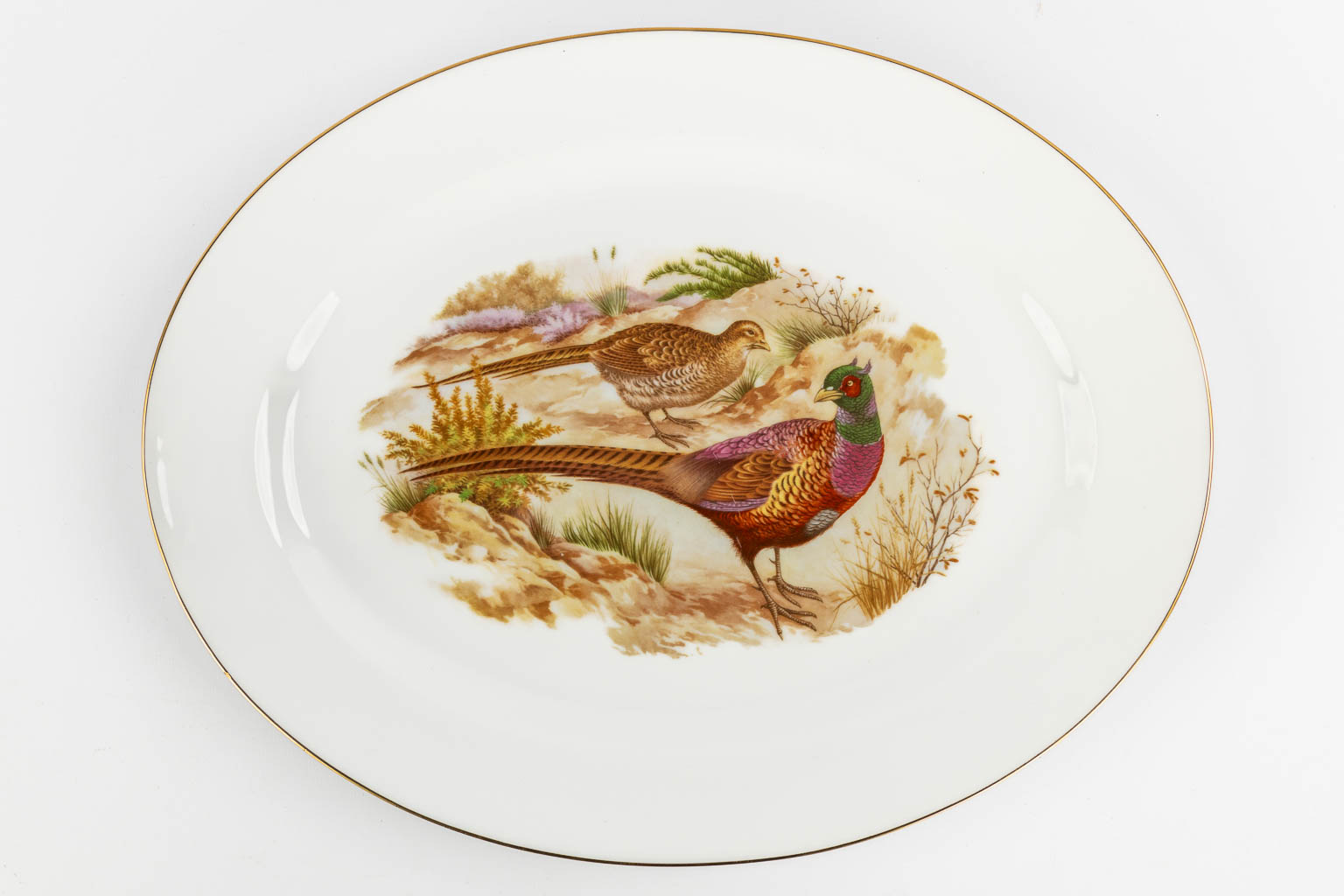 Limoges, a collection of fish-, cheese- and dinner plates. Porcelain. (L:31 x W:39 cm)