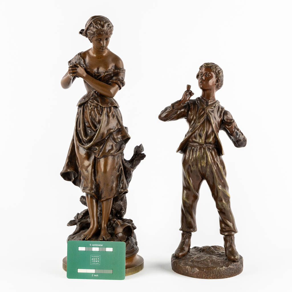 Twee gepatineerde bronzen figuren van een Dame en Roker, circa 1900.